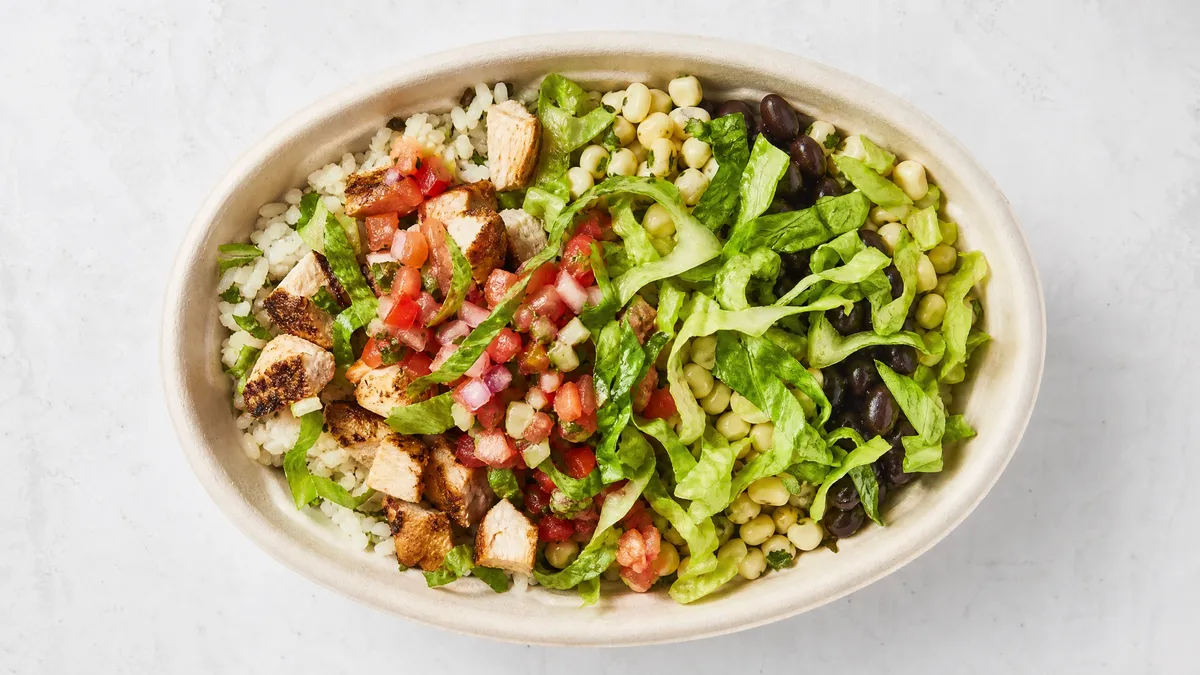 Chipotle chicken burrito bowl with rice, chicken, and fresh toppings