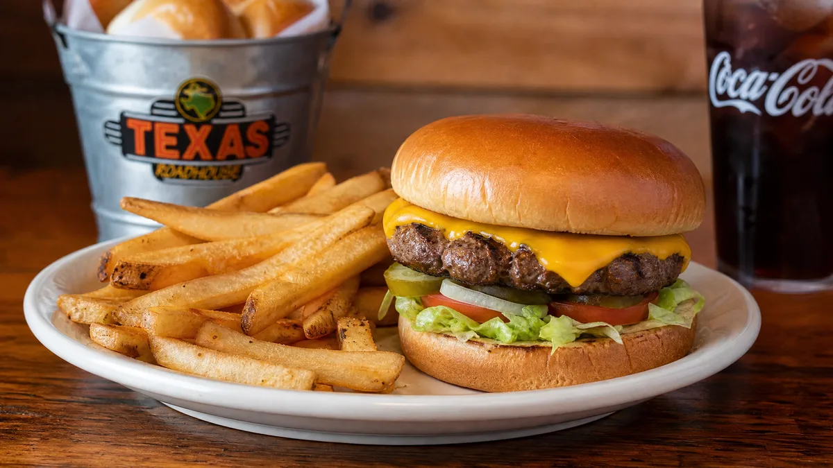 Texas Roadhouse cheeseburger with fries on the lunch menu